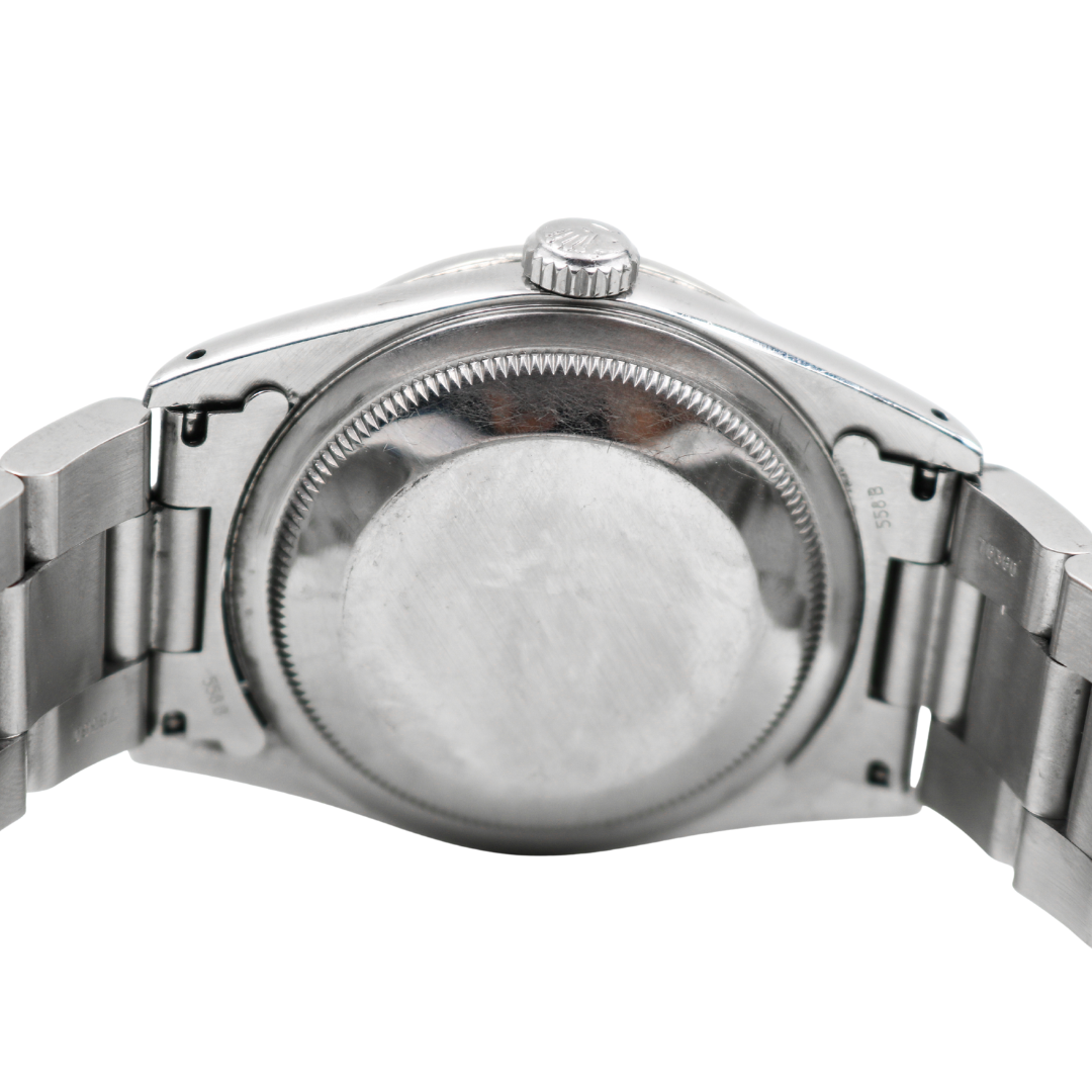 Close-up of Rolex Datejust caseback showing brushed stainless steel surface.