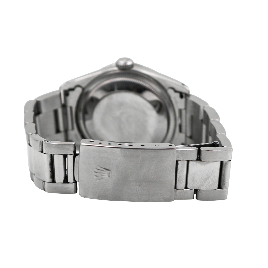 Closed clasp of Rolex Datejust bracelet with engraved Rolex crown logo.