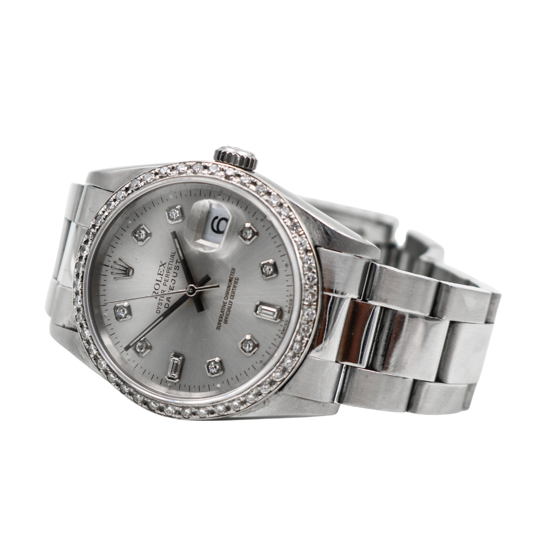 Rolex Datejust watch laid flat with dial and bracelet fully visible.