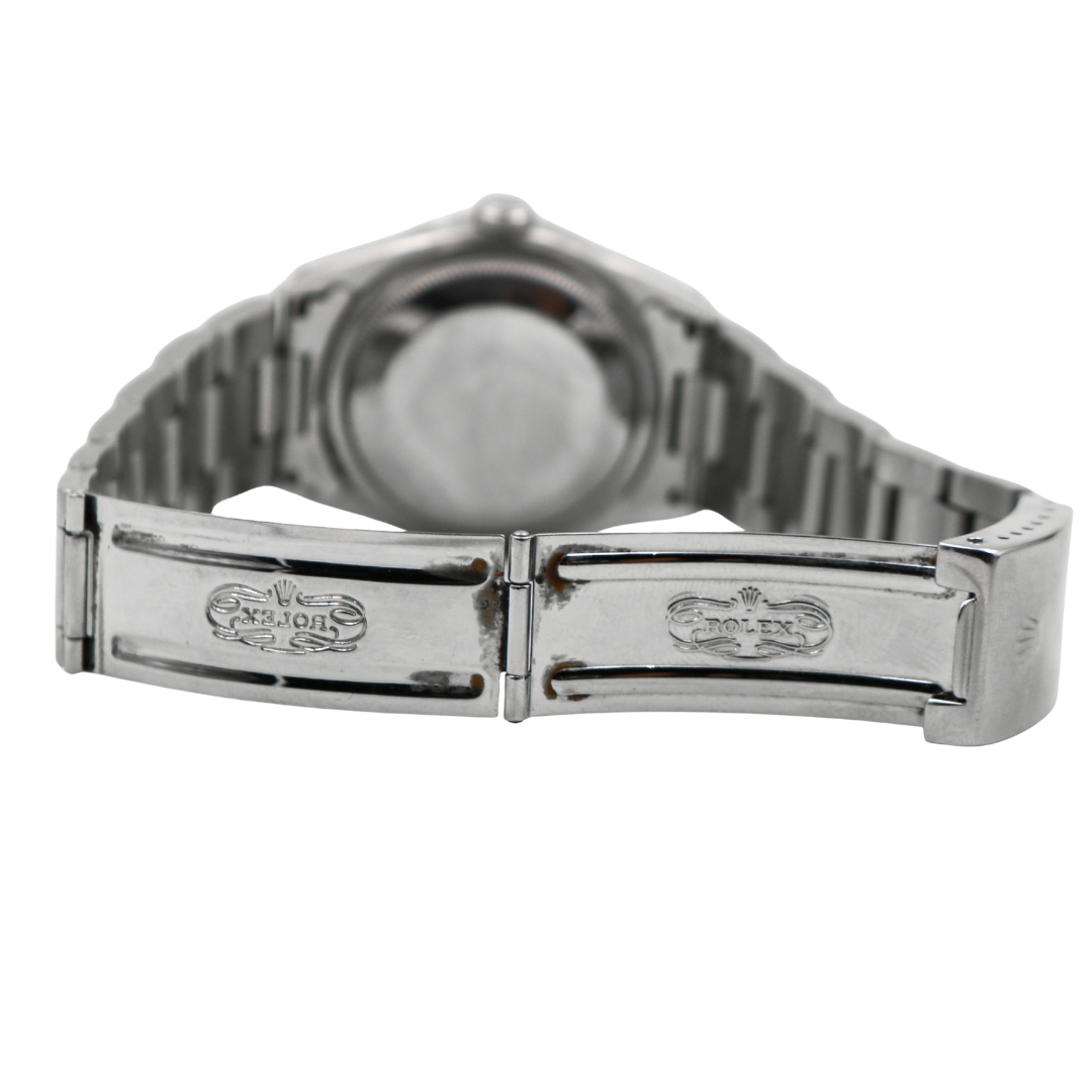 Opened clasp of Rolex Datejust showing engraved Rolex logo inside.