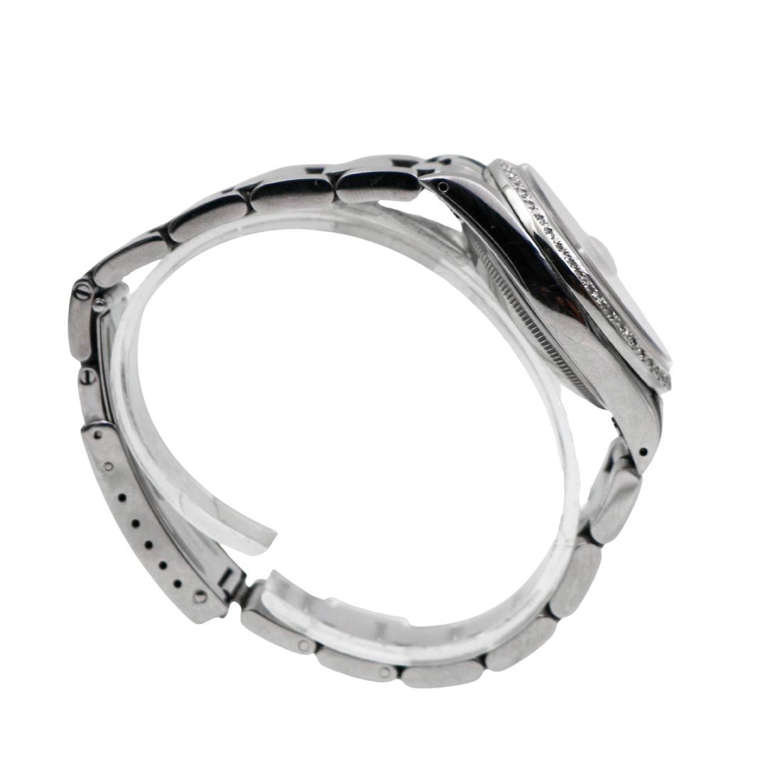 Right side profile of Rolex Datejust showing smooth bezel and bracelet links.
