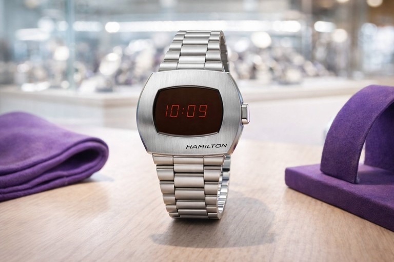 Vintage Hamilton digital watch with red LED display and stainless steel bracelet.