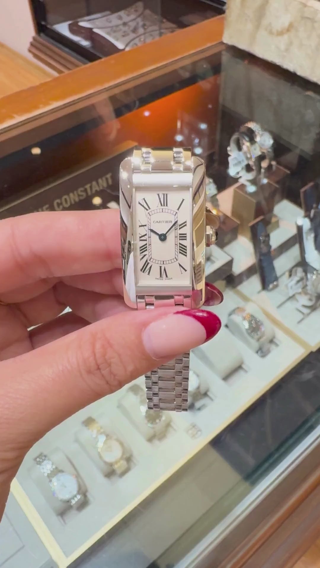 Cartier Ballon Bleu Small 18K White Gold watch held in hand